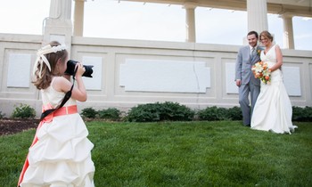 Emma gets a shot of the bride and groom.